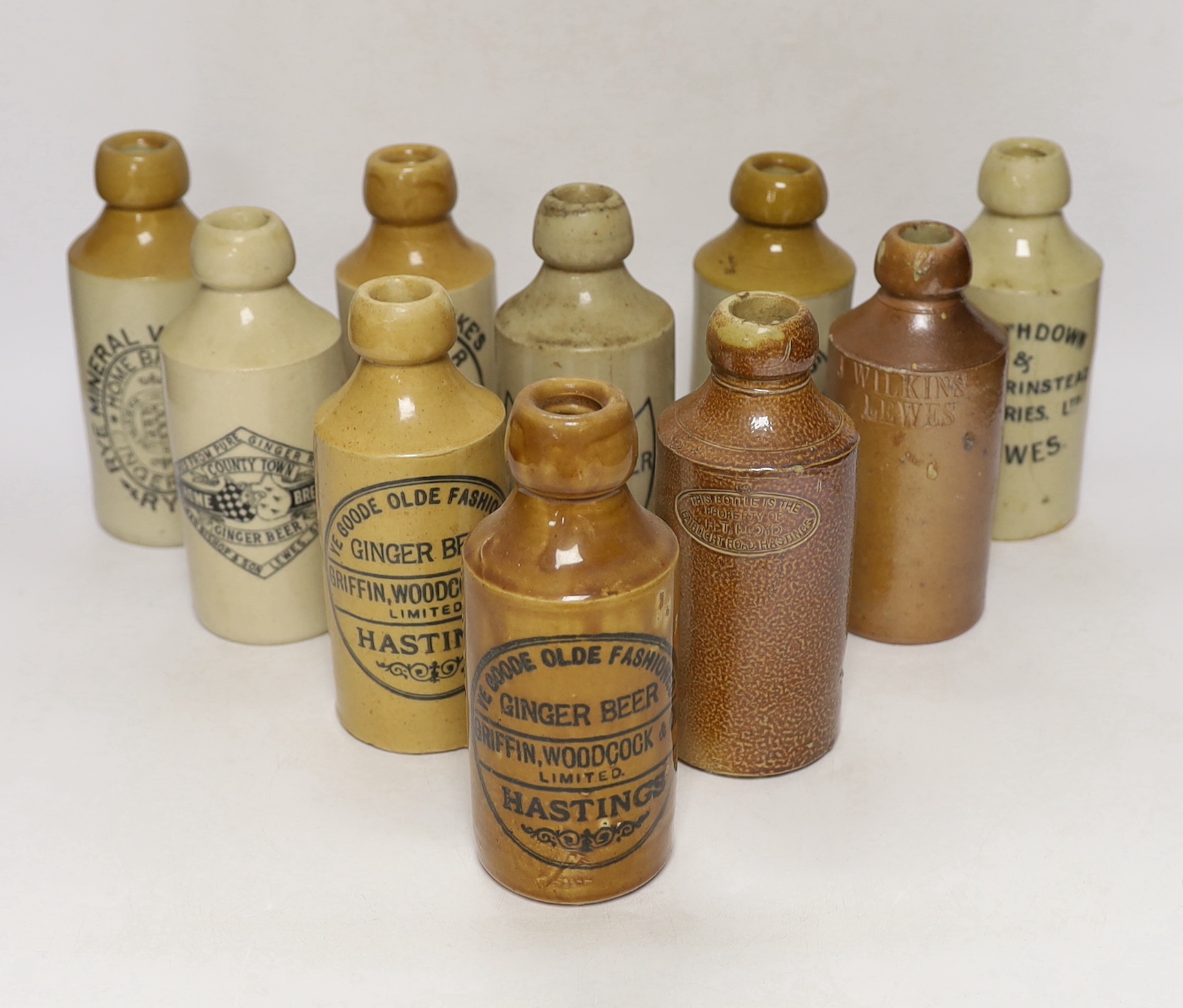 Early 20th century stoneware ginger beer bottles, four from Lewes, three from Hastings, two from Rye and one from St Leonards (10)